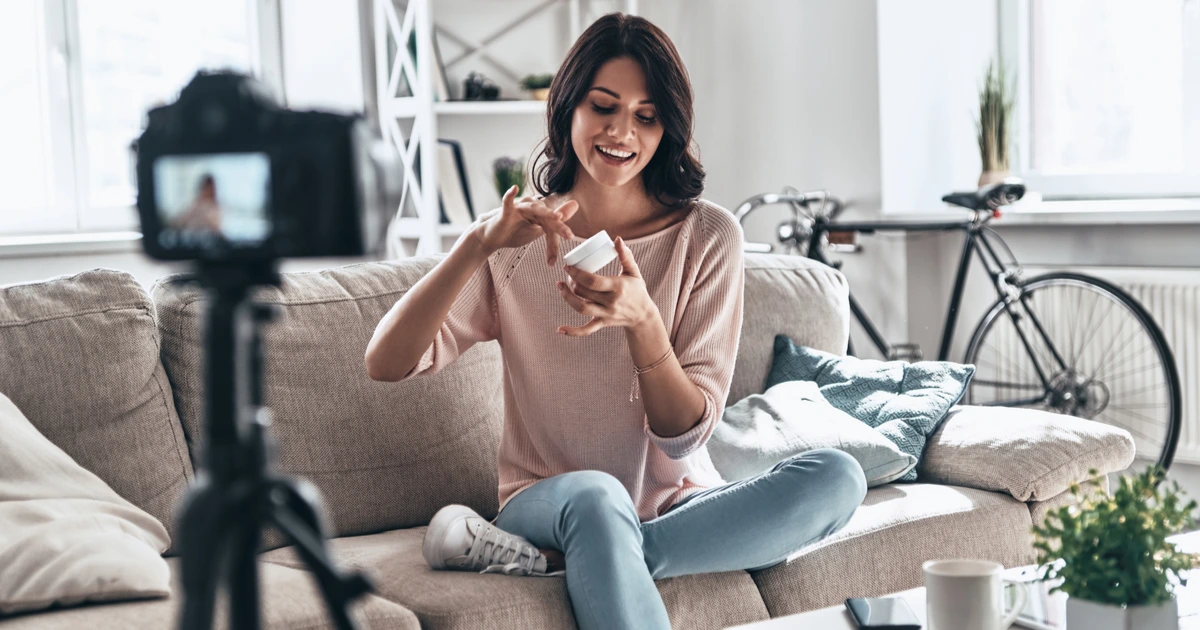 woman filming a product listing in her living room